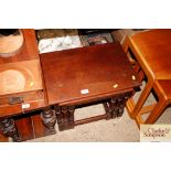 A nest of three oak occasional tables