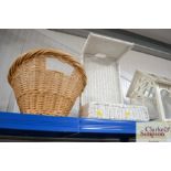 A wicker laundry basket and one other