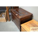 A stained pine wool chest