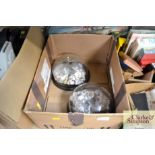 A box containing two glass domes and contents of t