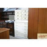 A near pair of bedside chests fitted three drawers