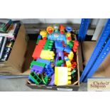 A box containing children's toys and building bloc