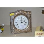 A silver mounted mantel clock