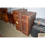 A leather bound traveling trunk together with a wo