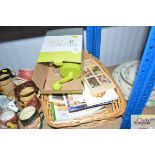 A basket and contents of cookery books and a kitch