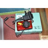 A Fuji Film camera with original box and charger