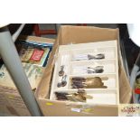 A box containing various cutlery etc.