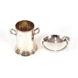 A silver miniature syphon stand, Sheffield 1928; and a circular Arts & Crafts dish with stylised