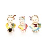 Three 19th Century German porcelain busts of children, with floral encrusted decoration, 6cm high