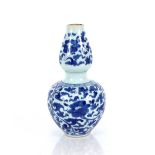 A Chinese blue and white double gourd shaped vase, having six character mark to base, 19cm high