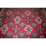 A Dosnealti carpet, South West Turkey, the red field with overall column of hooked and stepped