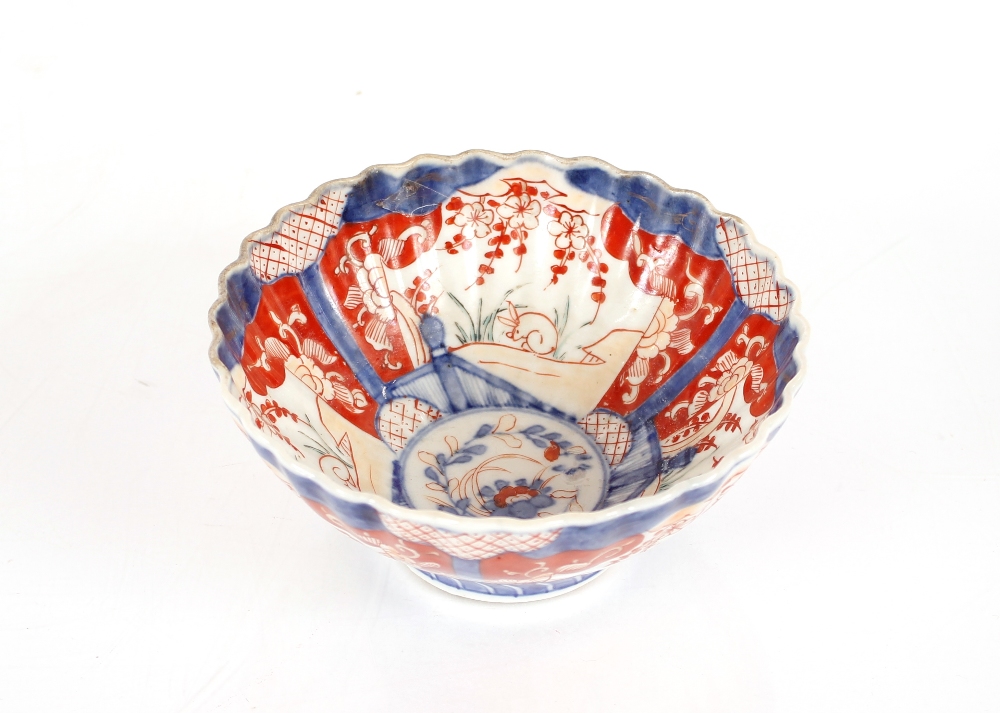 A 19th Century Chinese Imari scallop bordered bowl, decorated in the traditional palette, 14cm dia.