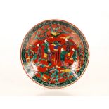 A Japanese shallow dish, decorated figures, 21.5cm dia.