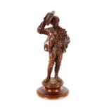 A bronze figure of a street entertainer, and monkey, 17cm high (one arm  AF)