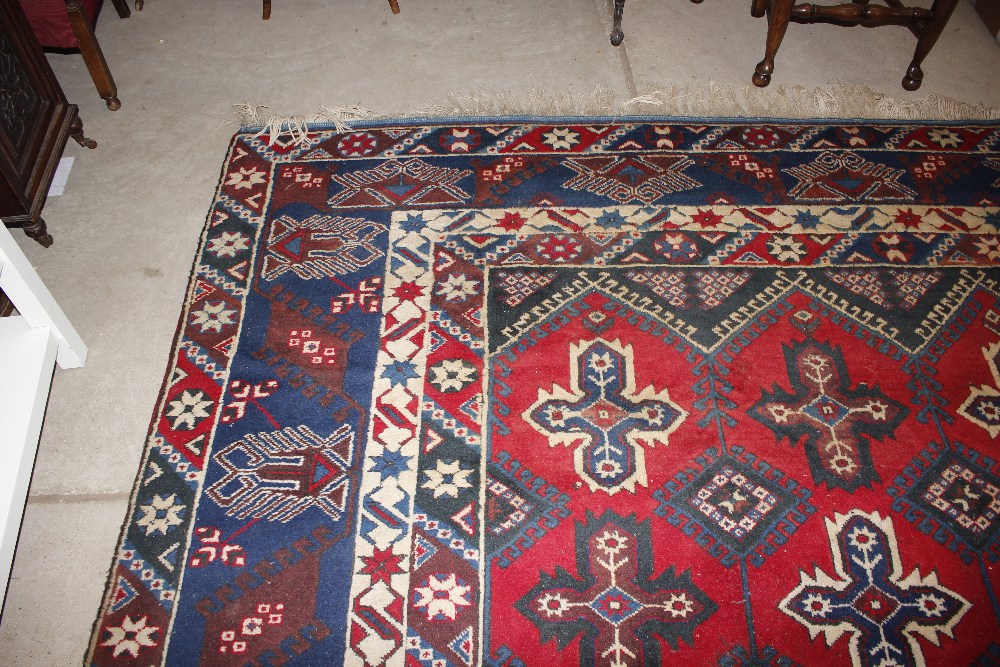 A Dosnealti carpet, South West Turkey, the red field with overall column of hooked and stepped - Image 14 of 15