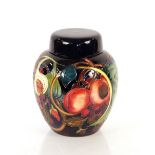 A Moorcroft fruit decorated vase and cover, circa. 2000, 21cm high