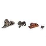 A 19th Century bronze figure of a lion; a pewter figure of a recumbent lion; a carved wooden