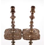 A pair of small plate on copper taper sticks, in the George I manner, 13cm high