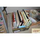 A box of various art related books