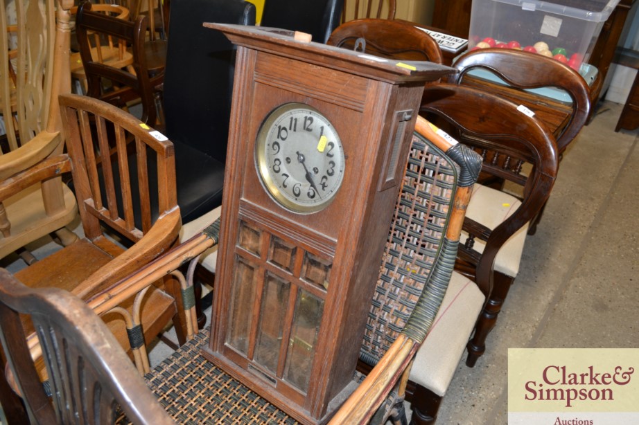 An oak cased wall clock