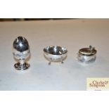 An Iraq silver and Niello ware three piece cruet