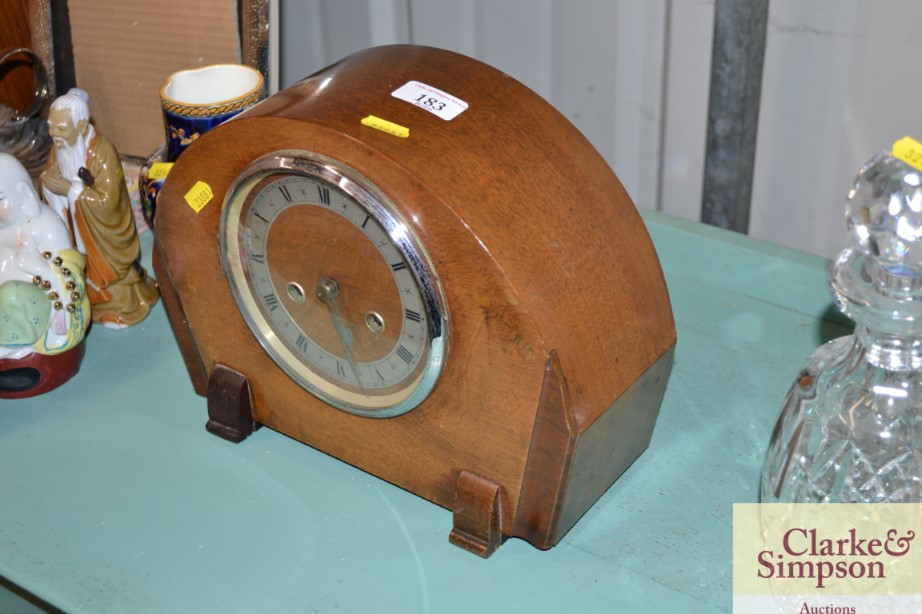 An Art Deco walnut cased mantel clock