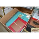 A box of various stamp albums and contents