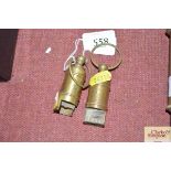 Two reproduction brass White Line whistles