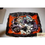 A basket of miscellaneous costume jewellery