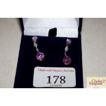 A pair of pink crystal and white metal drop ear-ri