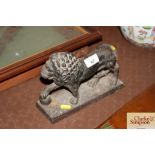 A Victorian cast iron lion door stop