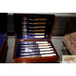 A cased set of six each plated fruit knives and fo