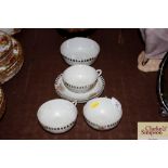 Three eggshell tea cups and saucers and matching b