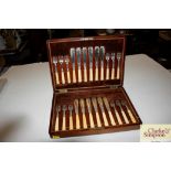 A set of twelve each silver bladed fish knives an