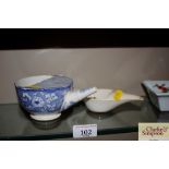 A 19th Century cream ware feeding cup and a blue a