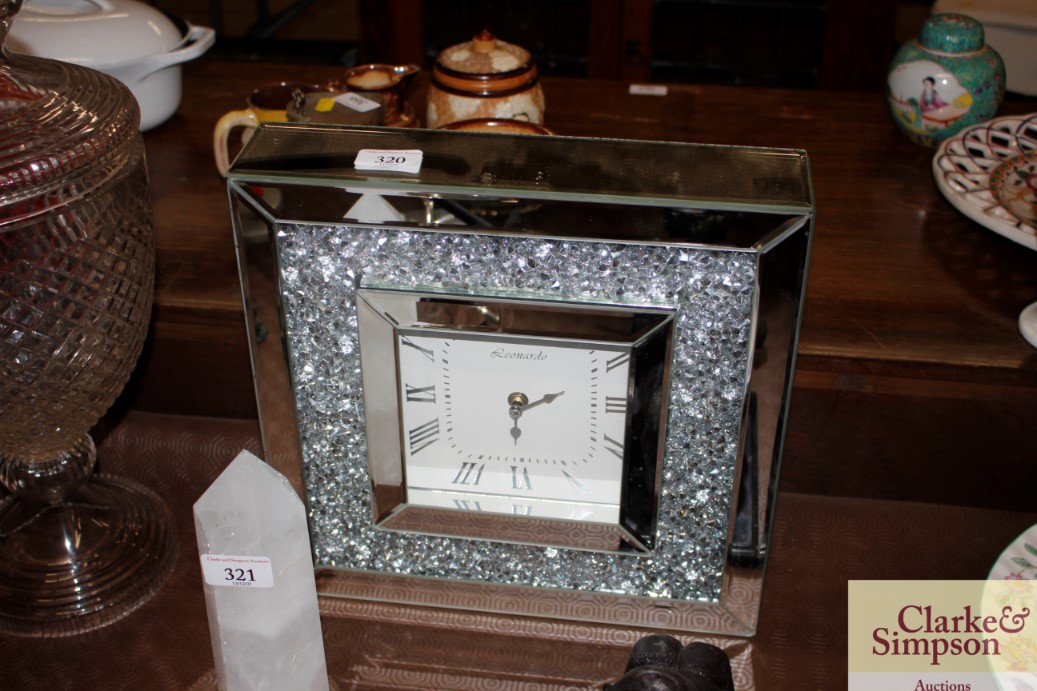 A mirrored and diamanté decorated clock