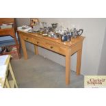 An oak console table fitted three drawers