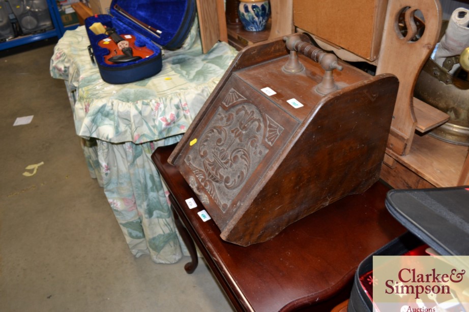 A late Victorian carved mahogany coal box