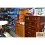 An Ercol dresser raised on cupboard base, fitted t