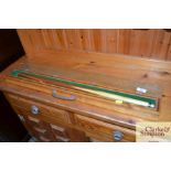 A pool cue in fitted wooden case