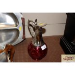 A ruby glass and electro plate mounted claret jug