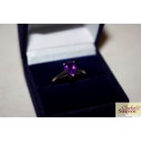 A boxed 925 and purple stone set dress ring