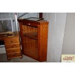 A modern pine hanging corner cabinet