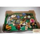 A small tray box of miscellaneous costume brooches