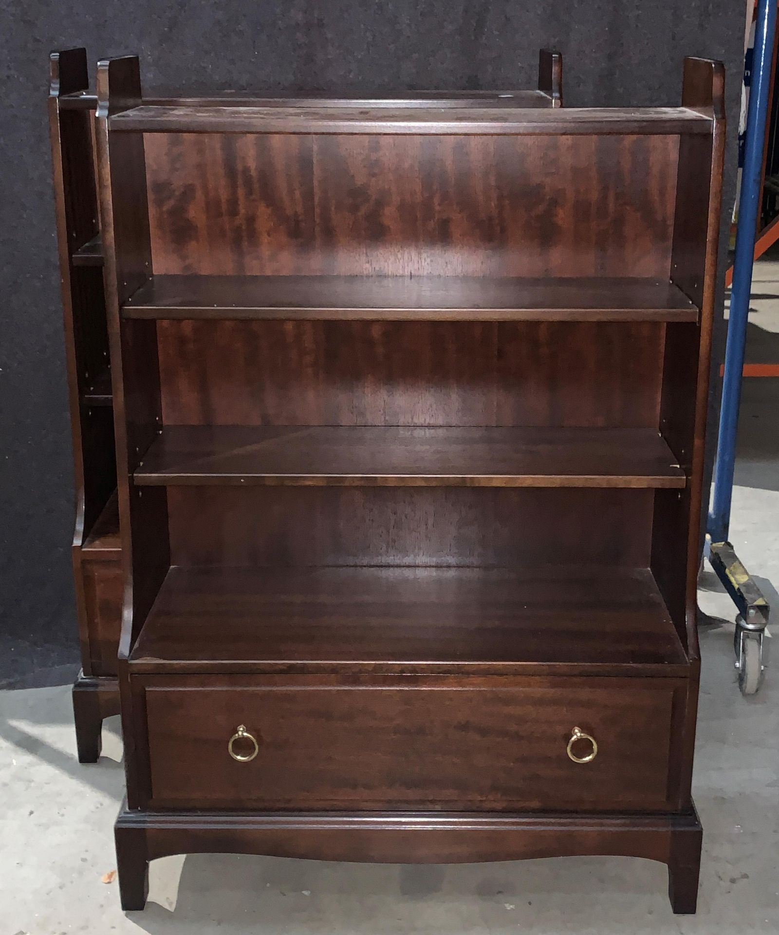 A pair of Stag mahogany finish water fall three shelf bookcases with under drawer each 76 x 113cm