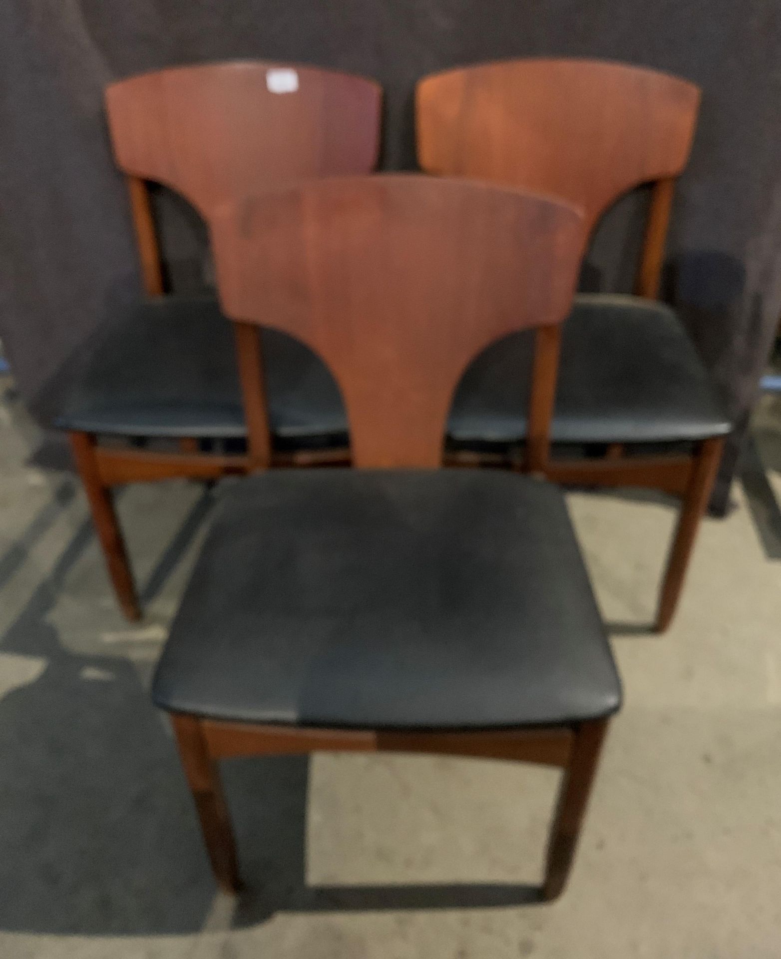 Three teak 1960s dining chairs with black PVC seats - [Please note - the upholstery in this lot - Image 2 of 4