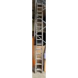 A thirty two rung aluminium double extension ladder