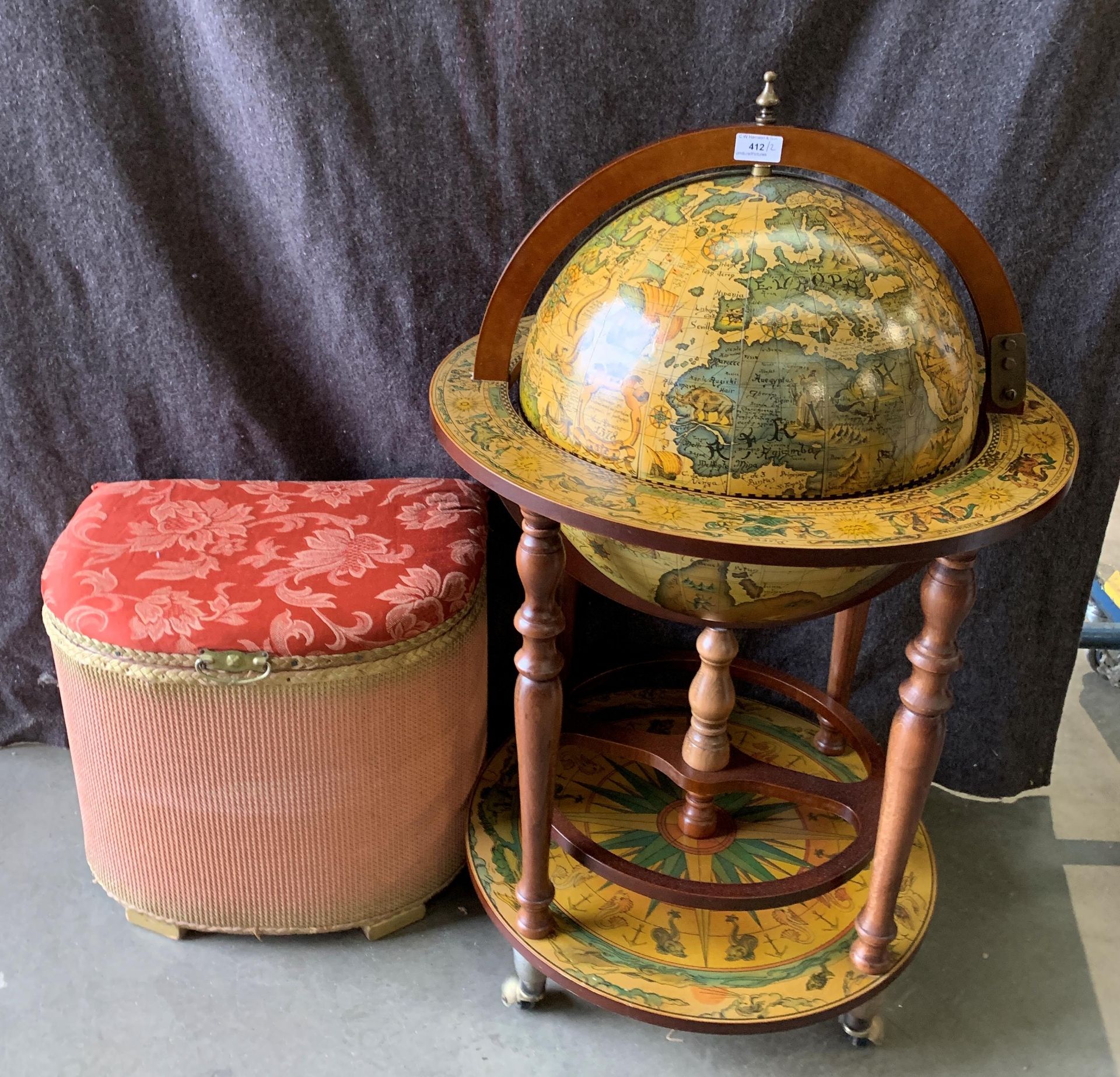 A reproduction Globe drinks cabinet and a Lloyd Loom style linen basket with upholstered top (2)