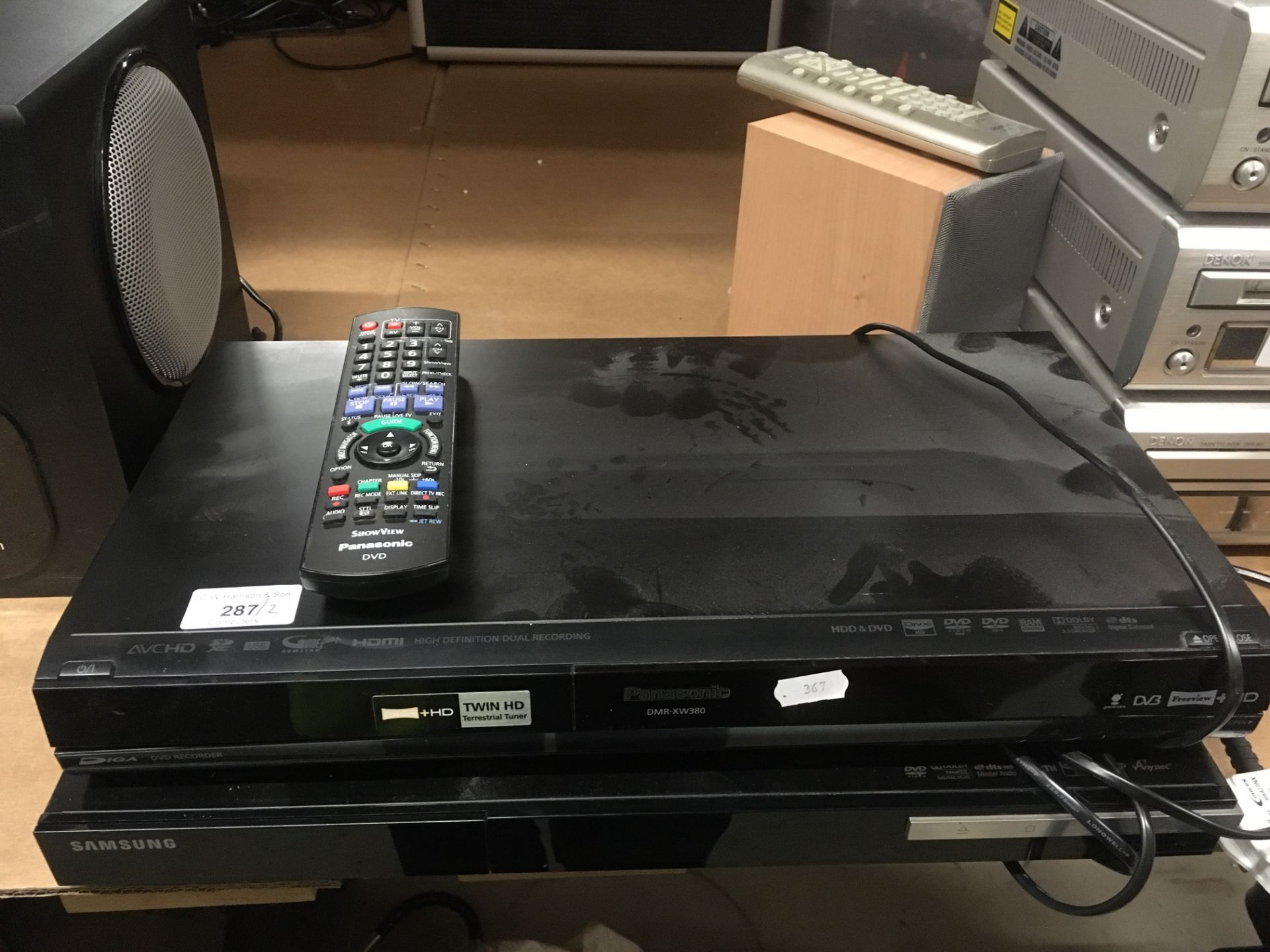 A Panasonic DMR-XW380 DVD recorder complete with remote control and a Samsung Blu-Ray disc player