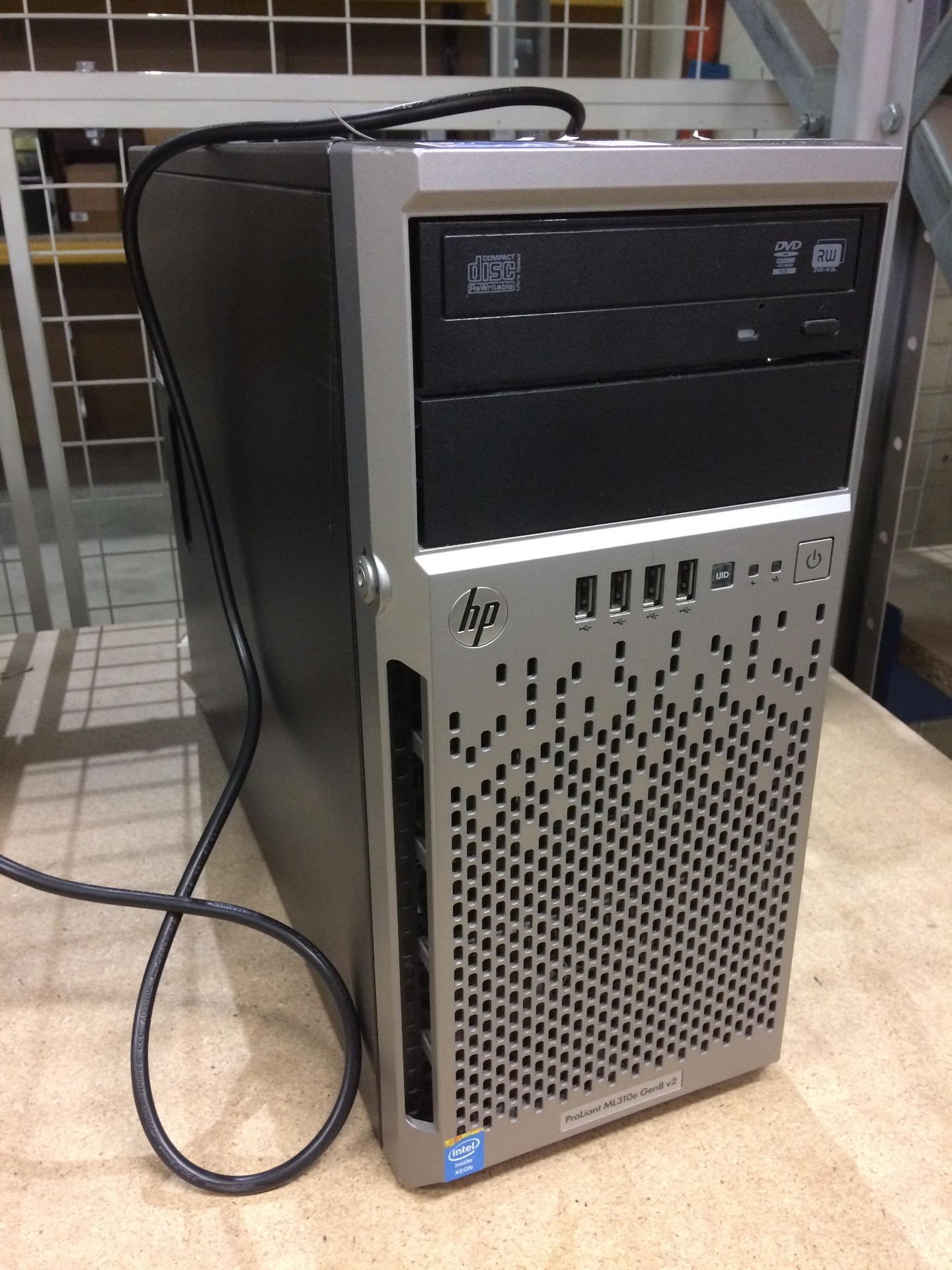 An HP Proliant ML310e Gen 8V2 tower computer complete with lead